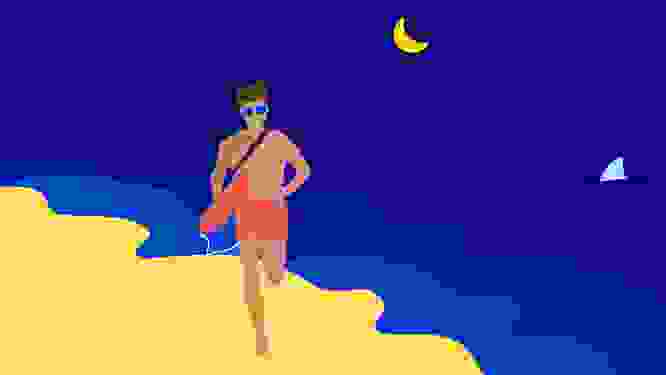 Image of a lifeguard jogging along the beach at night