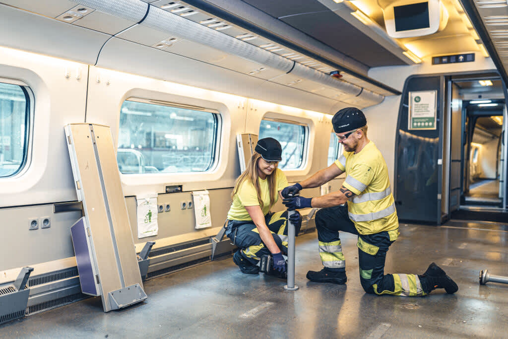 Workers assembling a VR Group train car